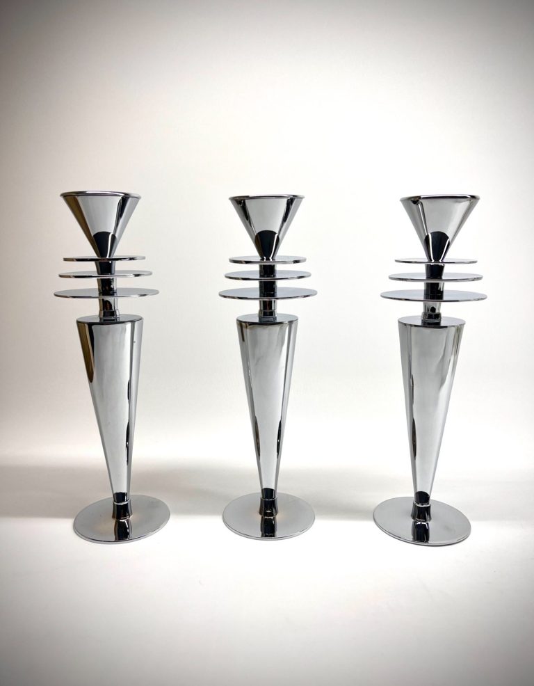 Trio of vintage candlesticks with stepped Art Deco design and chrome finish