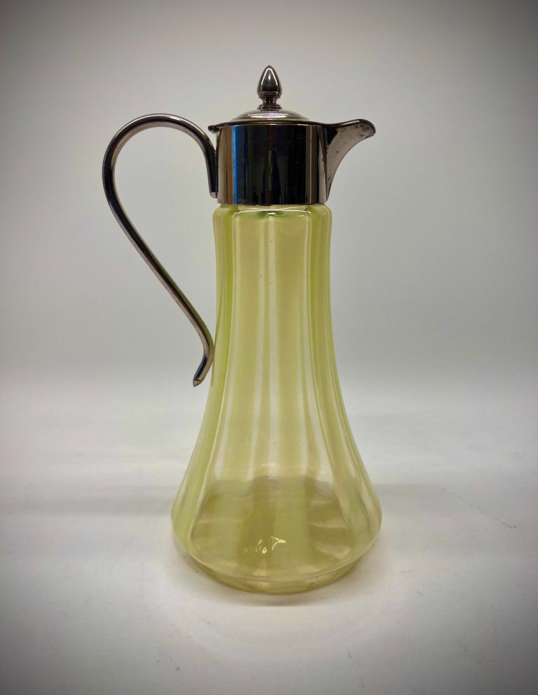 English Art Nouveau uranium glass jug with silver-plated lid and handle, fluted striped Vaseline glass body, ca. 1900.