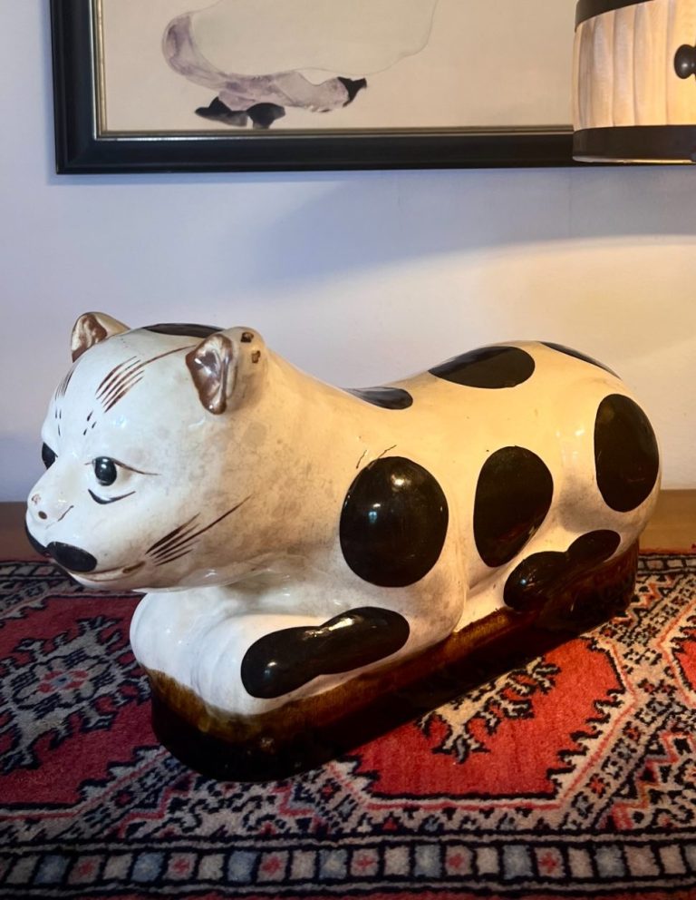 Cizhou-style ceramic cat pillow with black spots and white glaze, reclining form, late Qing or early 20th century