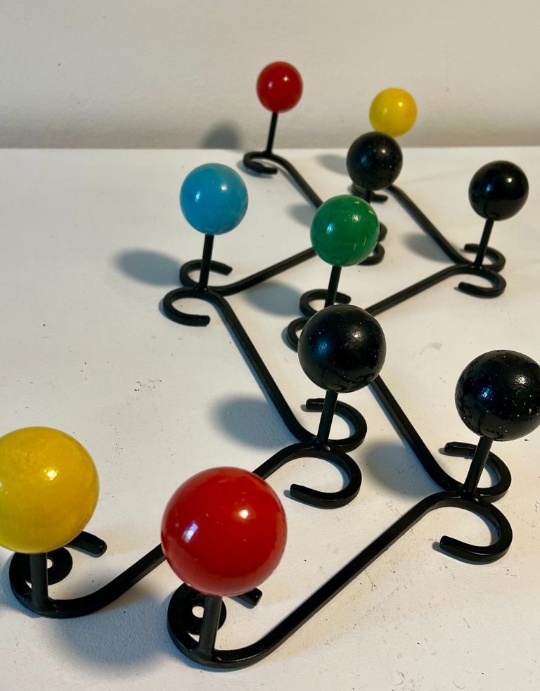 Pair of 1970s Atomic Age wall coat racks with colorful ball knobs and black metal arms