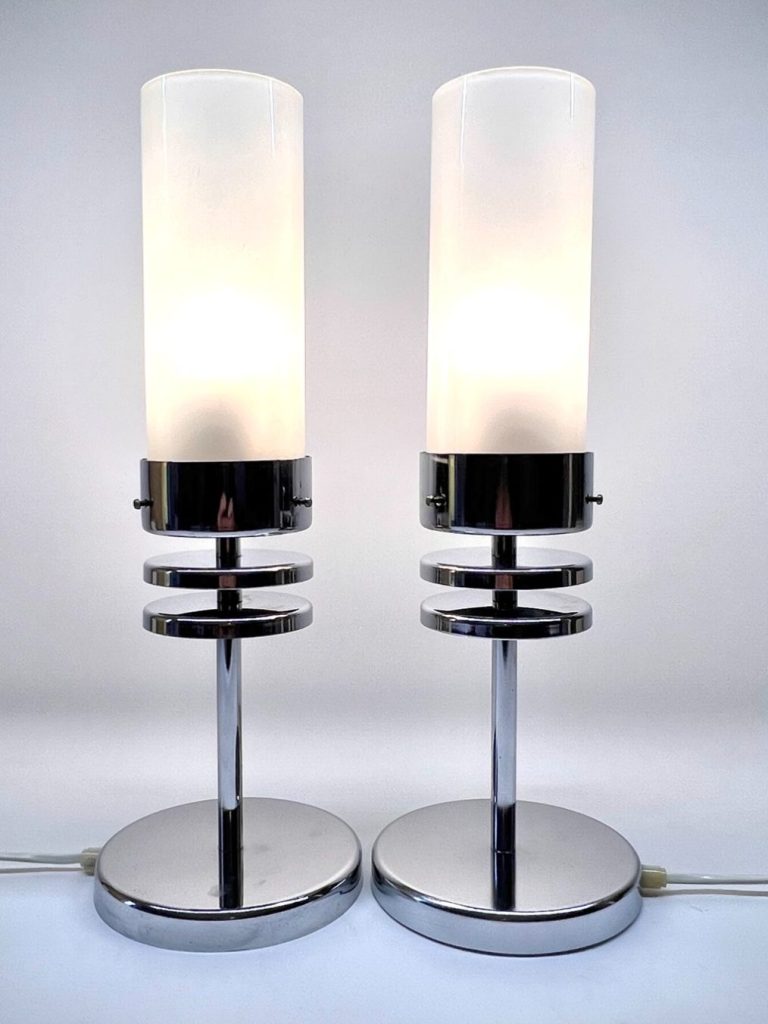 Pair of Italian Punto Luce table lamps from 1980s with curved chrome stems, turquoise frosted glass shades, and solid clear Murano glass 