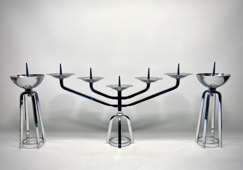 Trio of vintage candlesticks with stepped Art Deco design and chrome finish