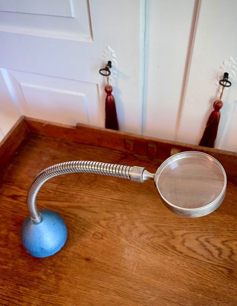 Vintage industrial-style magnifying glass with flexible gooseneck stem and hammered metal base, mid-20th century, likely German or Swiss